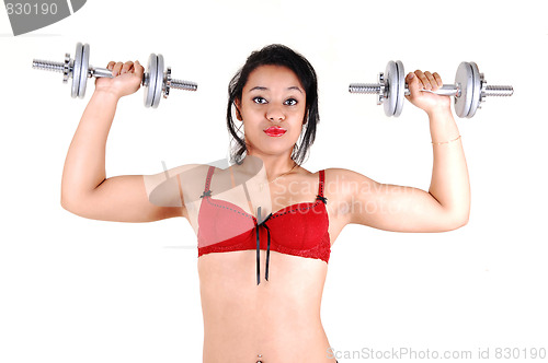 Image of Young girl lifting weight.