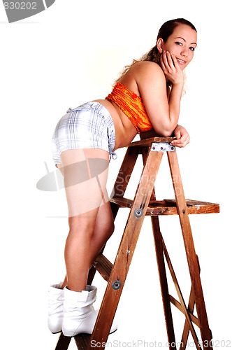 Image of Pretty girl on the stepladder.