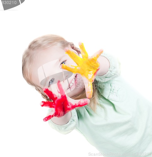 Image of Little girl playing with colors