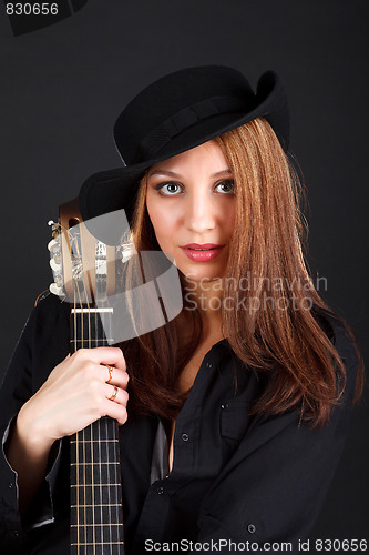 Image of Woman with guitar.