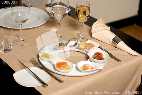 Image of Starter or Entree of a french dish with fish, seafood mixed and foie gras