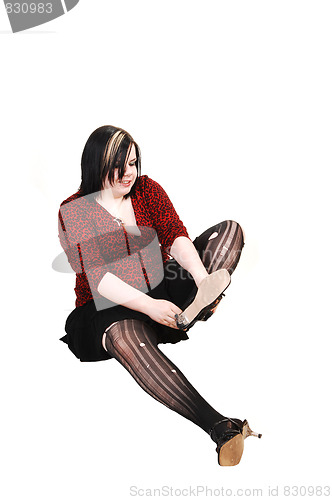 Image of Girl with torn up pantyhose.
