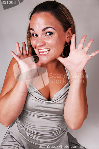 Image of Pretty girl in silver dress.