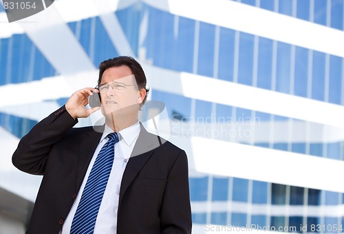 Image of Concerned Businessman Talks on His Cell Phone