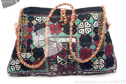 Image of detail macro of hand made knitted turkish kilm handbag pattern h
