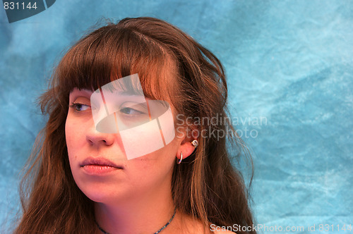 Image of beautiful brown haired woman looking to side