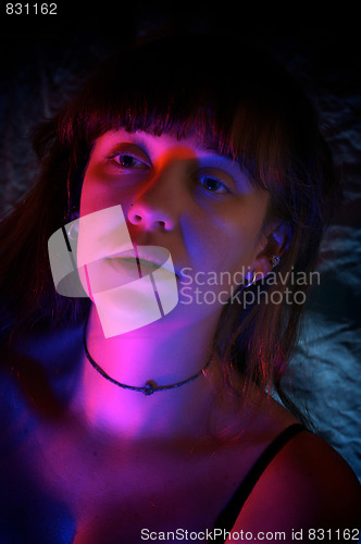 Image of woman lit with red and blue