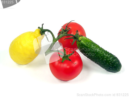 Image of Vegetables and fruit on a branch