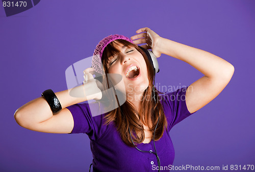 Image of Beautiful woman listening music