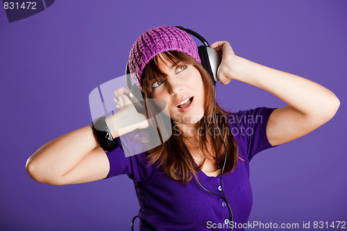 Image of Beautiful woman listening music