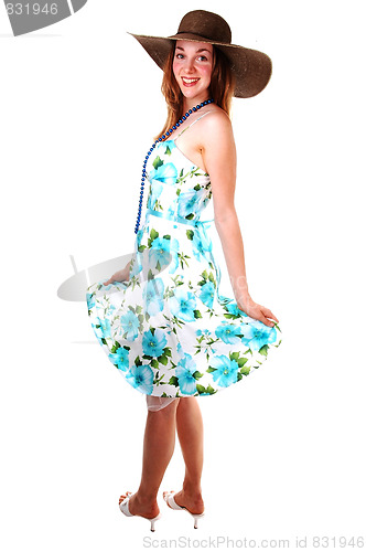 Image of Pretty girl in a white and green dress.