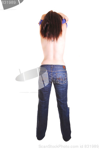 Image of Topless woman in jeans.