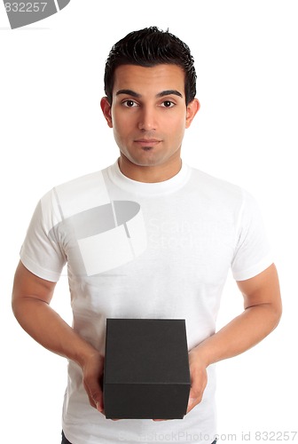 Image of Man holding box product or gift