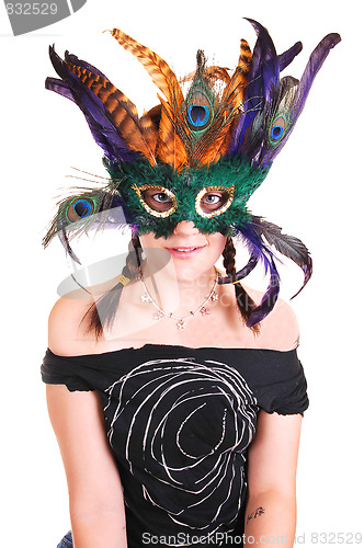 Image of Young girl with feather mask.