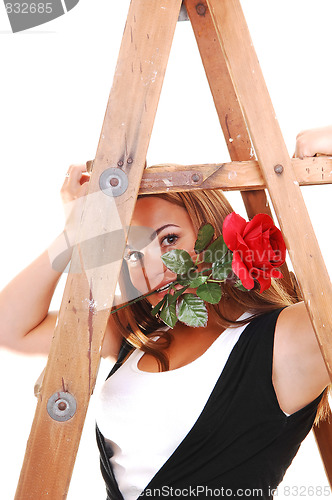 Image of Pretty girl under the stepladder.