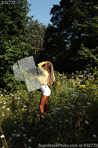 Image of Young Jamaican girl in the woods.