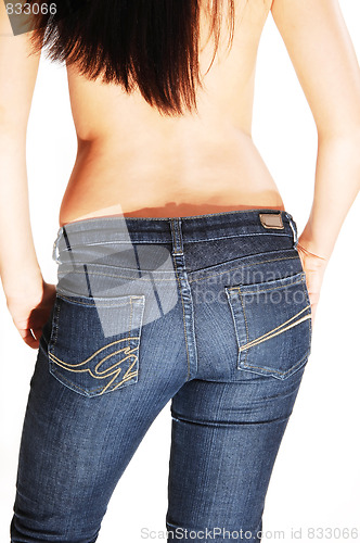 Image of Topless woman in jeans.