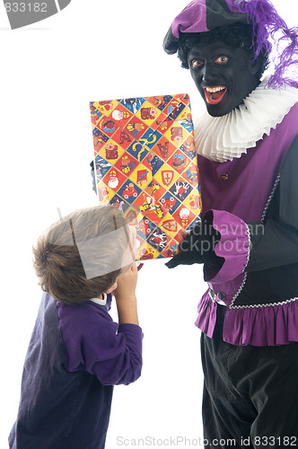 Image of Zwarte Piet giving a child his present