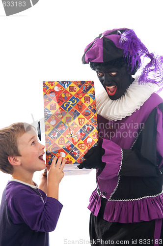 Image of Zwarte Piet giving a child his present