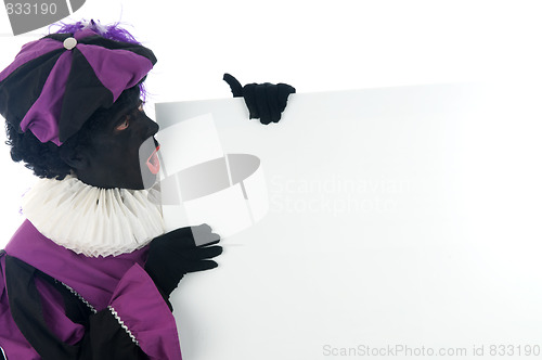 Image of Zwarte Piet looking at a white board, to put your text in.