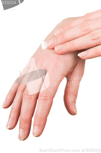 Image of Woman putting cream on her hands