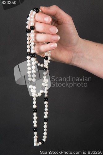 Image of Holding A Necklace