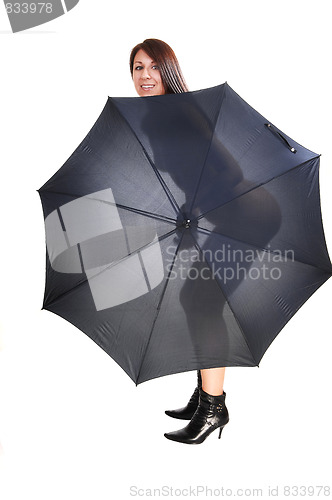 Image of Nude woman with open umbrella.