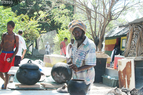 Image of rasta man preparing food 319