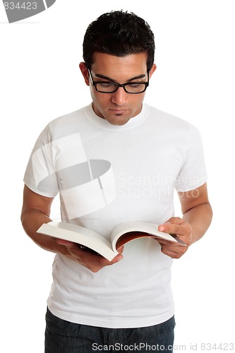 Image of University student or man reading a textbook