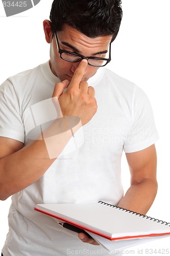 Image of Student pushing up glasses onto face