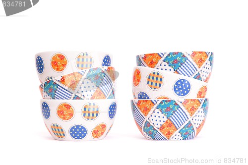 Image of Two zigzag stacks of porcelain bowls isolated