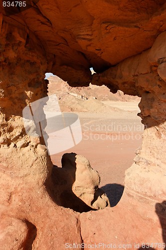 Image of Window in the orange sandstone rock in desert