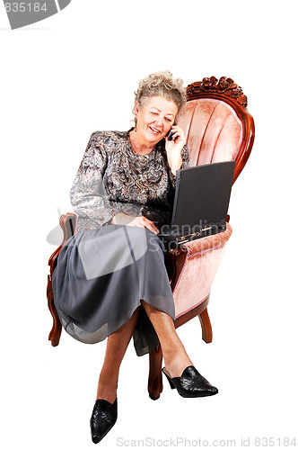 Image of Business woman in armchair.