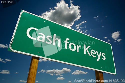 Image of Cash for Keys Green Road Sign Over Clouds