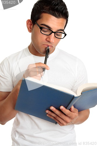 Image of Man or student pondering or thinking intently