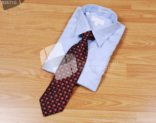 Image of Blue dress shirt with tie.