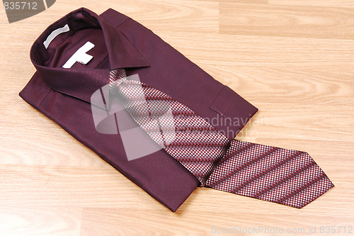 Image of Burgundy dress shirt with tie.