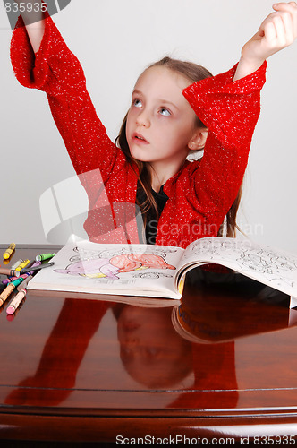 Image of Little girl coloring.