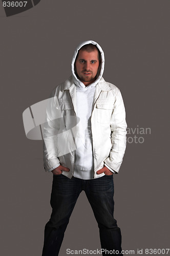 Image of Young man on dark background.