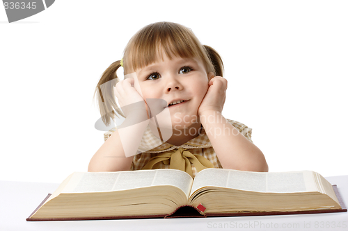 Image of Happy little girl with book, back to school