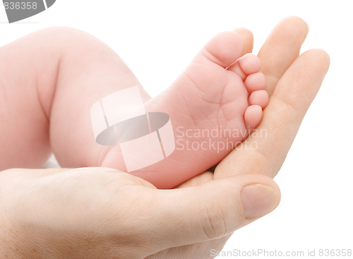 Image of Mother holding her newborn's foot