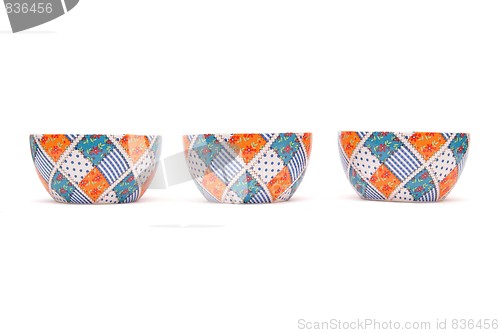 Image of Row of three porcelain bowls isolated