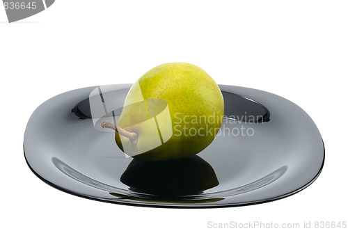 Image of Pear on a black platte, isolated