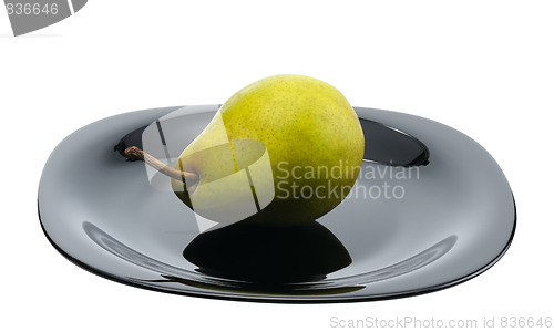 Image of Pear on a black platte, isolated