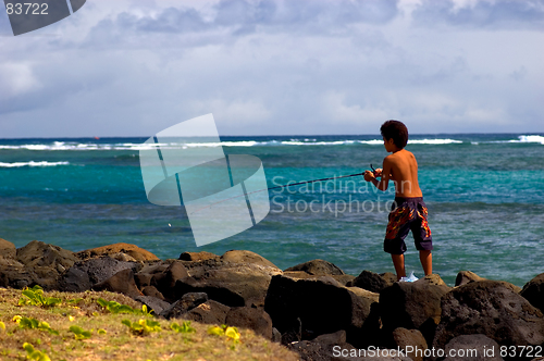 Image of island child fishing