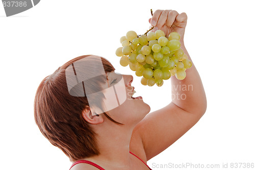 Image of Woman eating grapes