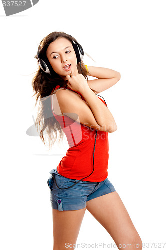 Image of Young girl listen music