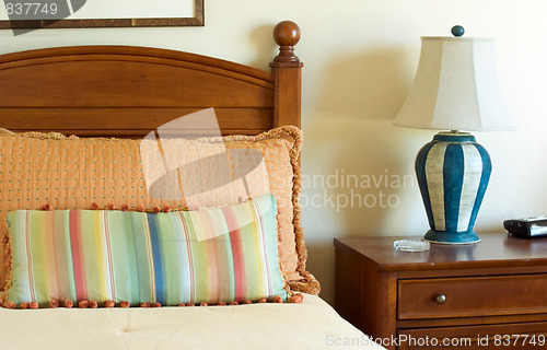 Image of bedroom with striped pillows