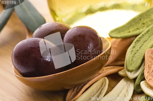 Image of pasta, black olives, oil with fresh branch. food ingredients 