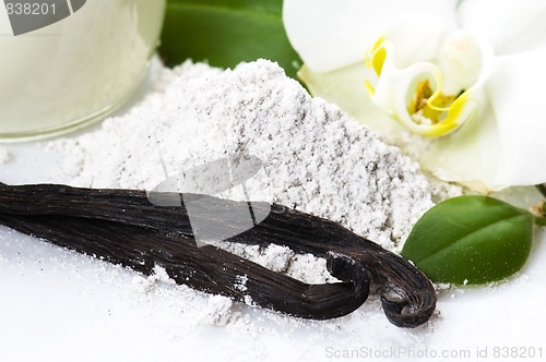 Image of vanilla beans with aromatic sugar, milk and flower 
